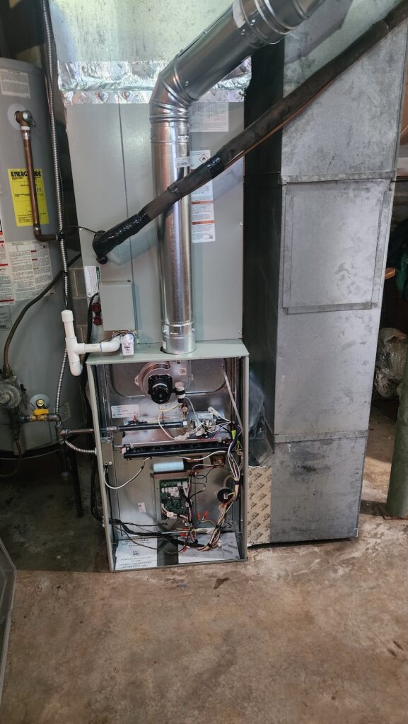 Remodeled HVAC system with exposed wiring and ductwork in Birmingham, AL.